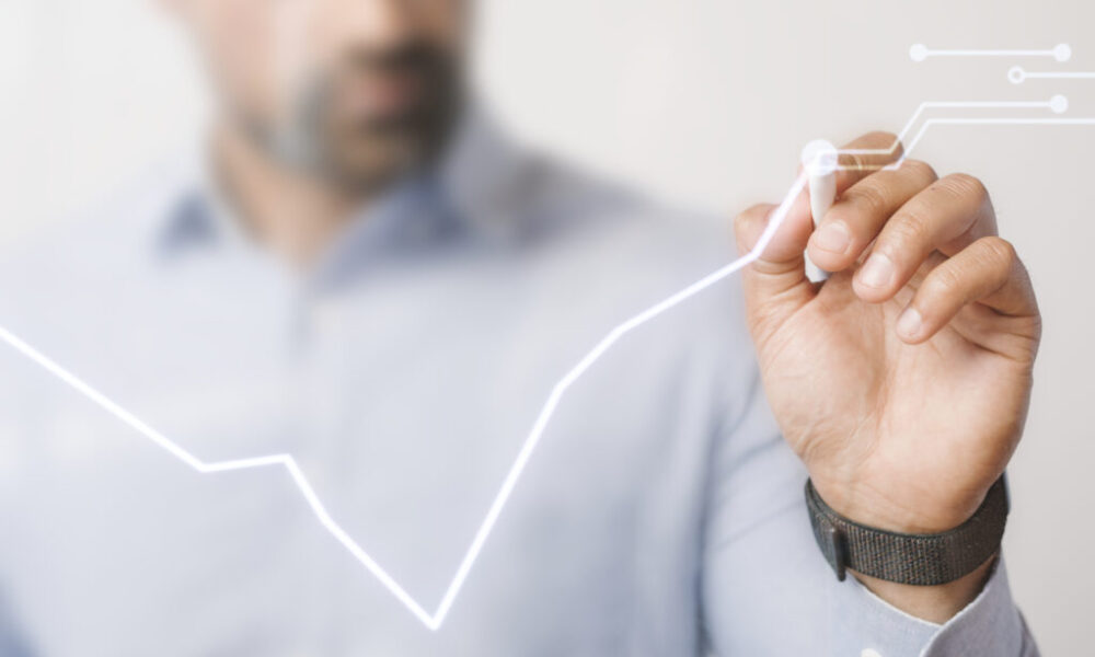 Man giving a business presentation using a futuristic digital pe